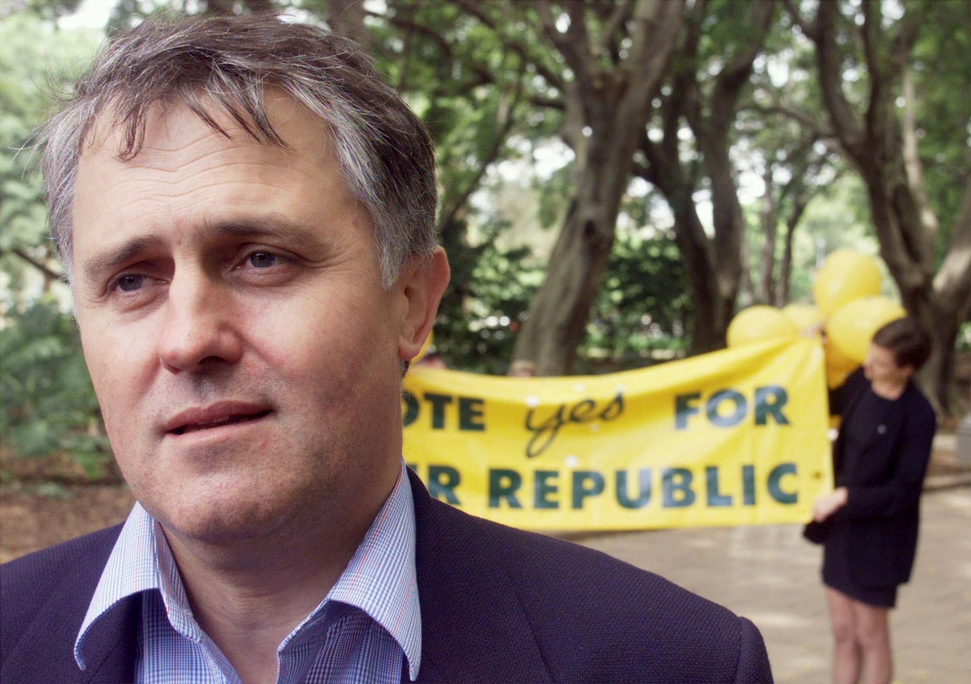 Man in front on Republic banner.